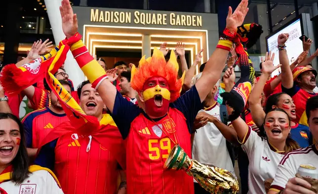 Spain fans gather for a rally on the eve of the World Cup final soccer match in New York's Times Square, Saturday, July 18, 2026 (AP Photo/Yuki Iwamura)