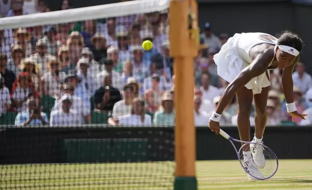 Coco Gauff of the United States returns the ball to Karolina Muchova of the Czech Republic in their semifinal women's singles match at the Wimbledon Tennis Championships in London, Thursday, July 9, 2026. (AP Photo/Kin Cheung)