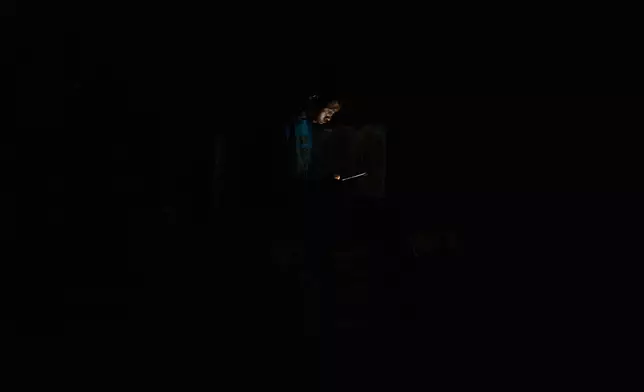 A man looks at his cell phone during a blackout in Havana, Cuba, Monday, July 6, 2026. (AP Photo/Ramon Espinosa)