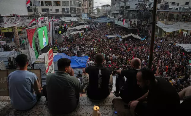 Palestinians watch a live broadcast of the World Cup round of 16 soccer match between Argentina and Egypt in Nuseirat, central Gaza Strip, Tuesday, July 7, 2026. (AP Photo/Abdel Kareem Hana)