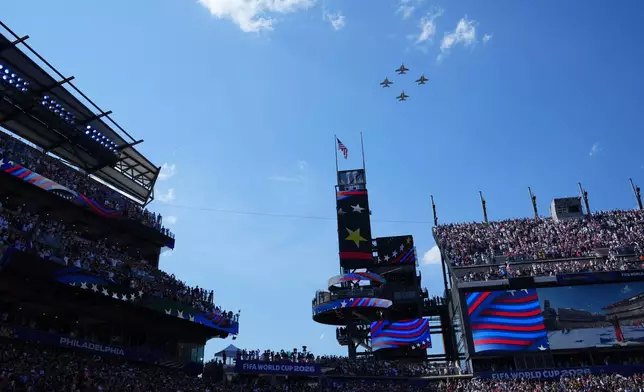 Planes fly over the stadium during a pregame ceremony before the World Cup round of 16 soccer match between Paraguay and France in Philadelphia, Saturday, July 4, 2026. (AP Photo/Petr David Josek)