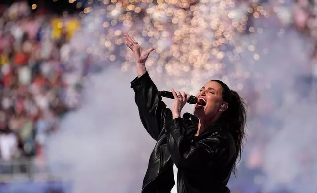 Idina Menzel sings the U.S. national anthem ahead of the World Cup round of 16 soccer between Paraguay and France match in Philadelphia, Saturday, July 4, 2026. (AP Photo/Matt Slocum)