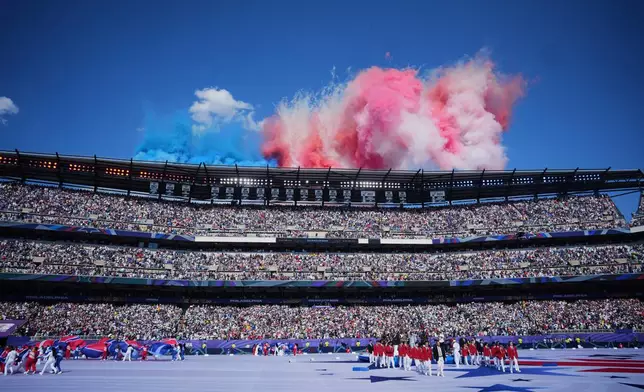 Fireworks explode over the stadium during a pregame ceremony before the World Cup round of 16 soccer match between Paraguay and France in Philadelphia, Saturday, July 4, 2026. (AP Photo/Petr David Josek)
