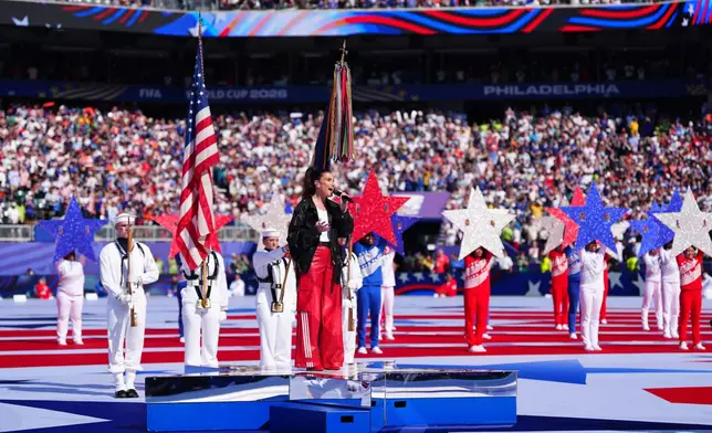 Idina Menzel sings the "Star-Spangled Banner", the United States' national anthem, before the World Cup round of 16 soccer match between Paraguay and France in Philadelphia, Saturday, July 4, 2026. (AP Photo/Derik Hamilton)