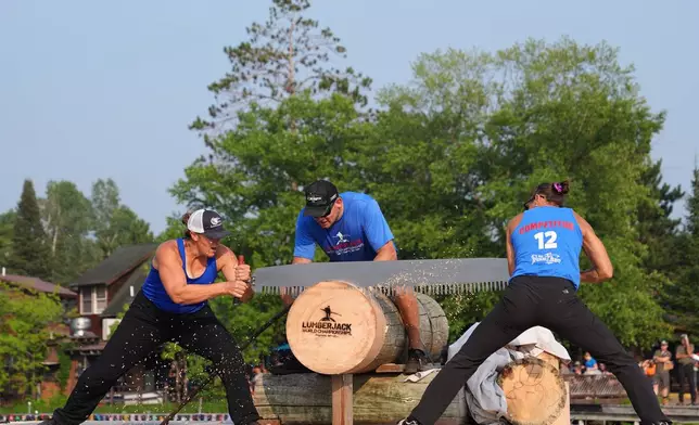 Kate Witkowski, left, and Erin Lavoie compete in the Jill and Jill event during the Lumberjack World Championships, Saturday, July 18, 2026, in Hayward, Wis. (AP Photo/Ellen Schmidt)