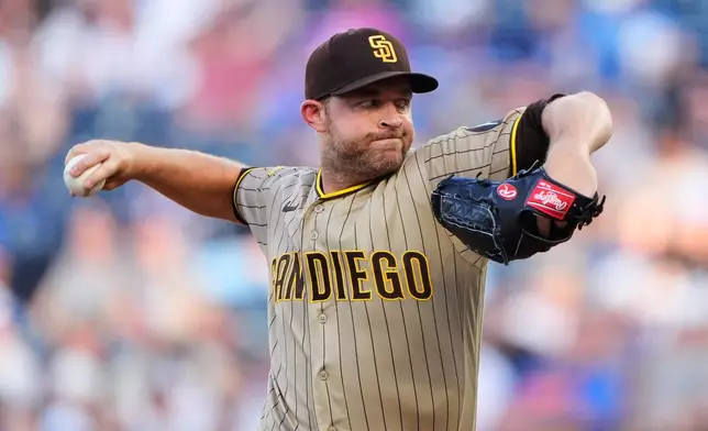 San Diego Padres starting pitcher Michael King throws during the first inning of a baseball game, Friday, July 17, 2026, in Kansas City, Mo. (AP Photo/Charlie Riedel)