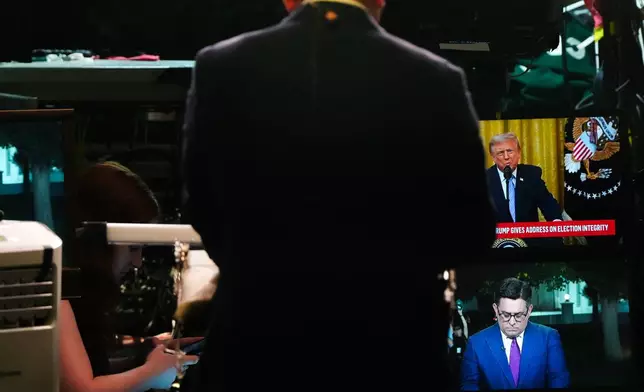 CBS News correspondent Ed O'Keefe prepares to film a stand-up as President Donald Trump speaks from the East Room of the White House, Thursday, July 16, 2026, in Washington. (AP Photo/Julia Demaree Nikhinson)