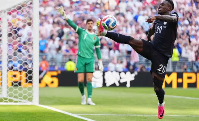 United States' Folarin Balogun tries to control the ball during the World Cup round of 16 soccer match against Belgium in Seattle, Monday, July 6, 2026. (AP Photo/Manu Fernandez)