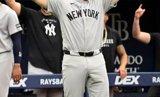 New York Yankees' Ben Rice celebrates after his two-run home run is upheld during the third inning of a baseball game against the Tampa Bay Rays Thursday, July 9, 2026, in St. Petersburg, Fla. (AP Photo/Jason Behnken)