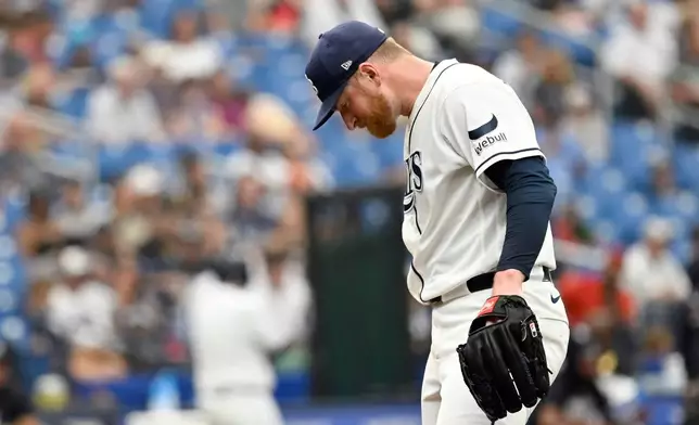 Tampa Bay Rays pitcher Drew Rasmussen reacts after New York Yankees' Ben Rice's two-run home run is upheld during the third inning of a baseball game Thursday, July 9, 2026, in St. Petersburg, Fla. (AP Photo/Jason Behnken)