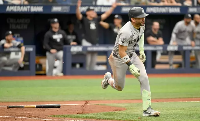 New York Yankees José Caballero runs to first for an RBI single during the third inning of a baseball game against the Tampa Bay Rays Thursday, July 9, 2026, in St. Petersburg, Fla. (AP Photo/Jason Behnken)