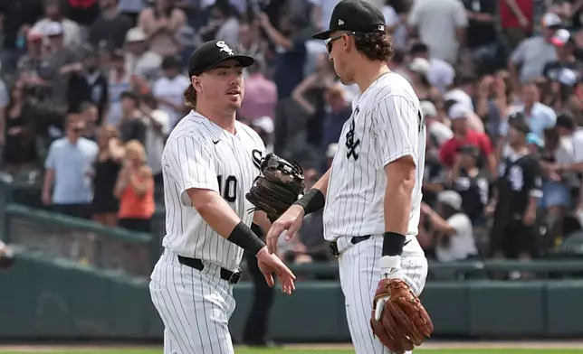 Chicago White Sox shortstop Colson Montgomery, right, and second baseman Chase Meidroth, left, celebrate after a baseball game against the Athletics, Saturday, July 11, 2026, in Chicago. (AP Photo/David Banks)