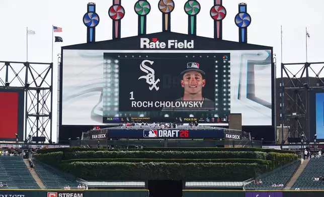 UCLA shortstop Roch Cholowsky goes No. 1 overall to the Chicago White Sox during the 2026 MLB Draft shown on the scoreboard before a baseball game between the Chicago White Sox and the Athletics Saturday, July 11, 2026, in Chicago. (AP Photo/David Banks)