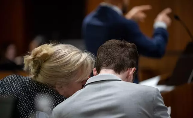 Defense attorney Kathryn Nester, left, talks to Tyler Robinson during a preliminary hearing in Fourth District Court for Robinson, who is accused of fatally shooting Charlie Kirk, in Provo, Utah, on Tuesday, July 7, 2026. (Trent Nelson/The Salt Lake Tribune via AP, Pool)