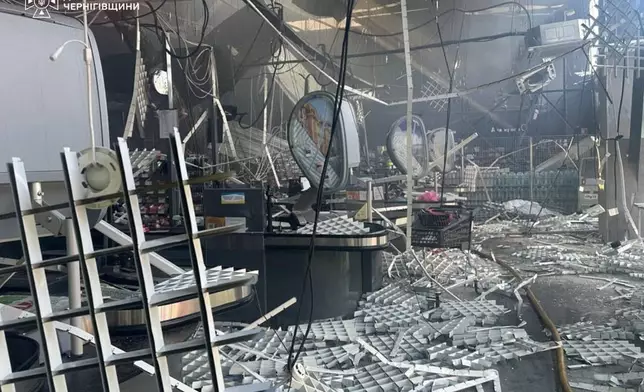 This photo provided by the Ukrainian Emergency Service shows a damaged supermarket after Russian drone strikes in Chernihiv, Ukraine, Sunday, July 26, 2026. (Ukrainian Emergency Service via AP)