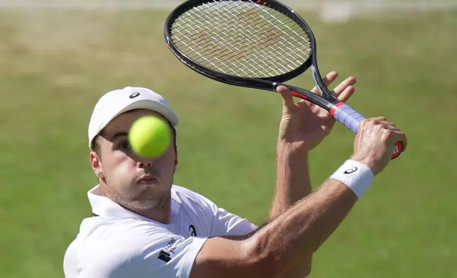 Arthur Fery of Britain eyes the ball as he prepares to return it to Zizou Bergs of Belgium in their third round men's singles match at the Wimbledon Tennis Championships in London, Saturday, July 4, 2026. (AP Photo/Brian Inganga)