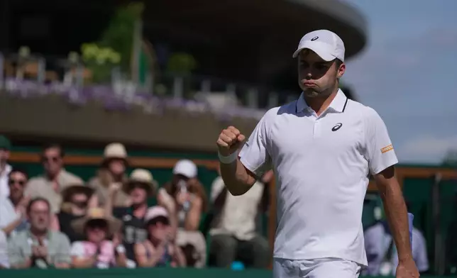 Arthur Fery of Britain celebrates a point against Zizou Bergs of Belgium in their third round men's singles match at the Wimbledon Tennis Championships in London, Saturday, July 4, 2026. (AP Photo/Brian Inganga)