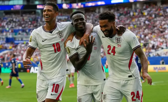 England's Bukayo Saka (7) celebrates scoring his side's 5th goal from the penalty spot during the World Cup third-place playoff soccer match between France and England in Miami Gardens, Fla., Saturday, July 18, 2026. (AP Photo/Lynne Sladky)