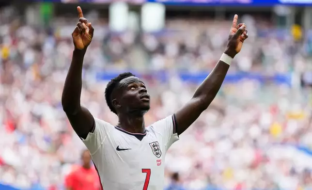 England's Bukayo Saka (7) celebrates scoring his side's fourth goal during the World Cup third-place playoff soccer match between France and England in Miami Gardens, Fla., Saturday, July 18, 2026. (AP Photo/Rebecca Blackwell)