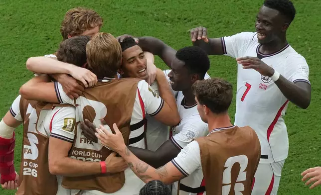 England's Jude Bellingham, center, celebrates scoring their sixth goal with teammates during the World Cup third-place playoff soccer match between France and England in Miami Gardens, Fla., Saturday, July 18, 2026. (AP Photo/Marta Lavandier)