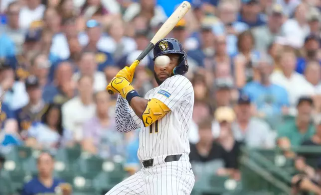 Milwaukee Brewers' Jackson Chourio reacts to a high and inside pitch during the first inning of a baseball game against the Miami Marlins Saturday, July 18, 2026, in Milwaukee. (AP Photo/Kayla Wolf)