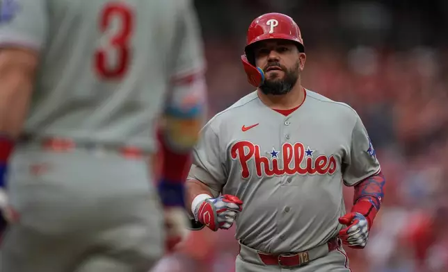 Philadelphia Phillies' Kyle Schwarber scores after hitting a two-run homer during the third inning of a baseball game against the Cincinnati Reds in Cincinnati, Tuesday, July 7, 2026. (AP Photo/Carolyn Kaster)