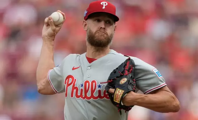 Philadelphia Phillies pitcher Zack Wheeler throws during the first inning of a baseball game against the Cincinnati Reds in Cincinnati, Tuesday, July 7, 2026. (AP Photo/Carolyn Kaster)