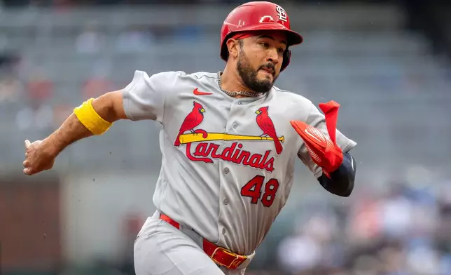 St. Louis Cardinals designated hitter Iván Herrera (48) rounds third base towards home during the first inning of a baseball game against the Atlanta BravesWednesday, July 1, 2026, in Atlanta. (AP Photo/Erik Rank)
