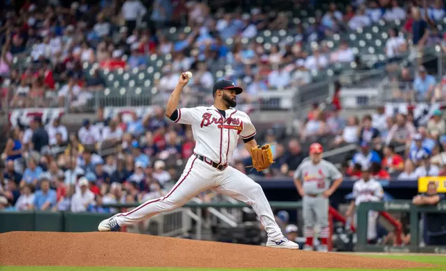 Atlanta Braves Reynaldo López (40) throws out the first pitch of the game during first inning of a baseball game against the St. Louis Cardinals Wednesday, July 1, 2026, in Atlanta. (AP Photo/Erik Rank)