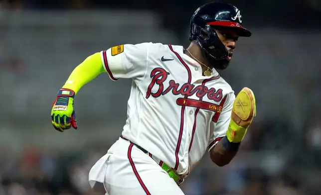 Atlanta Braves center fielder Michael Harris II (23) rounds third base during the eighth inning of a baseball game against the St. Louis Cardinals Wednesday, July 1, 2026, in Atlanta. (AP Photo/Erik Rank)