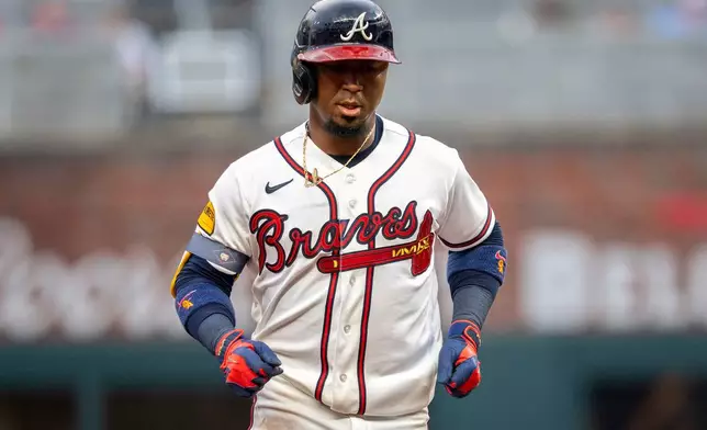 Atlanta Braves second baseman Ozzie Albies (1) scores a home run during the third inning of a baseball game against the St. Louis Cardinals Wednesday, July 1, 2026, in Atlanta. (AP Photo/Erik Rank)