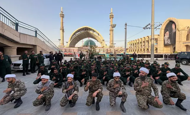 Revolutionary Guard members and clerics mourn on the esplanade of the Imam Khomeini Mosalla Grand Mosque as preparations are underway ahead of the dayslong funeral ceremonies for slain Iranian Supreme Leader Ayatollah Ali Khamenei in Tehran, Iran, Friday, July 3, 2026. (AP Photo/Vahid Salemi)