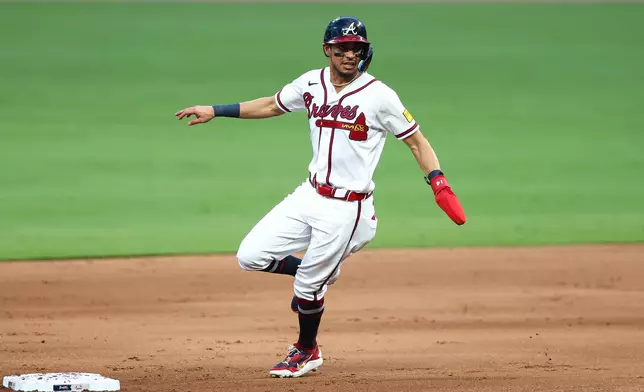 Atlanta Braves' Mauricio Dubón rounds second base in the first inning of a baseball game against the St. Louis Cardinals, Thursday, July 2, 2026, in Atlanta. (AP Photo/Colin Hubbard)