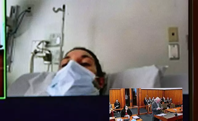 FILE - In this image from video, Lindsay Clancy, with a surgical mask over her face, appears from the hospital for her arraignment on charges regarding the death of her three children, at Plymouth District Court in Plymouth, Mass., on Feb. 7, 2023. (David Ryan/The Boston Globe via AP, Pool, File)