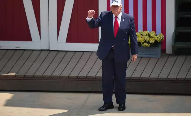 President Donald Trump leaves the stage after speaking at the Burning Hills Amphitheater during the Theodore Roosevelt Presidential Library opening ceremony Wednesday, July 1, 2026. (AP Photo/Matt Rourke)