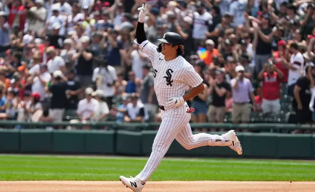 Chicago White Sox's Munetaka Murakami, of Japan, celebrates as he rounds the bases after hitting a two-run home run during the first inning of a baseball game against the Houston Astros in Chicago, Sunday, July 26, 2026. (AP Photo/Nam Y. Huh)