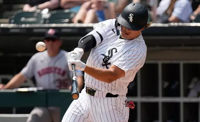 Chicago White Sox's Munetaka Murakami, of Japan, hits a two-run home run during the first inning of a baseball game against the Houston Astros in Chicago, Sunday, July 26, 2026. (AP Photo/Nam Y. Huh)
