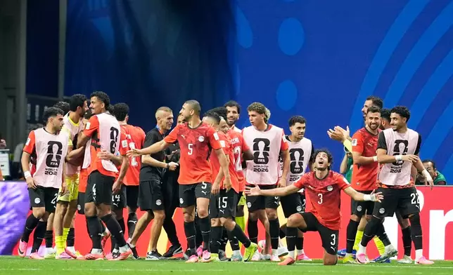 Egypt players celebrate after Egypt's Mostafa Zico scored his side's second goal during the World Cup round of 16 soccer match between Argentina and Egypt in Atlanta, Tuesday, July 7, 2026. (AP Photo/Mike Stewart)