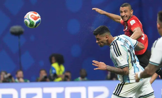 Argentina's Cristian Romero (13) scores his side's first goal during the World Cup round of 16 soccer match between Argentina and Egypt in Atlanta, Tuesday, July 7, 2026. (AP Photo/Jacob Kupferman)