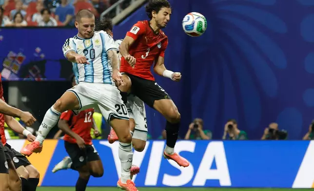Argentina's Alexis Mac Allister (20), left, and Egypt's Mohamed Hany (3) battle for the ball during the World Cup round of 16 soccer match between Argentina and Egypt in Atlanta, Tuesday, July 7, 2026. (AP Photo/Erik S. Lesser)