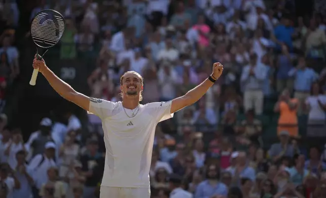 Alexander Zverev of Germany celebrates winning against Taylor Fritz of the United States in their quarter-final men's singles match at the Wimbledon Tennis Championships in London, Wednesday, July 8, 2026. (AP Photo/Kin Cheung)