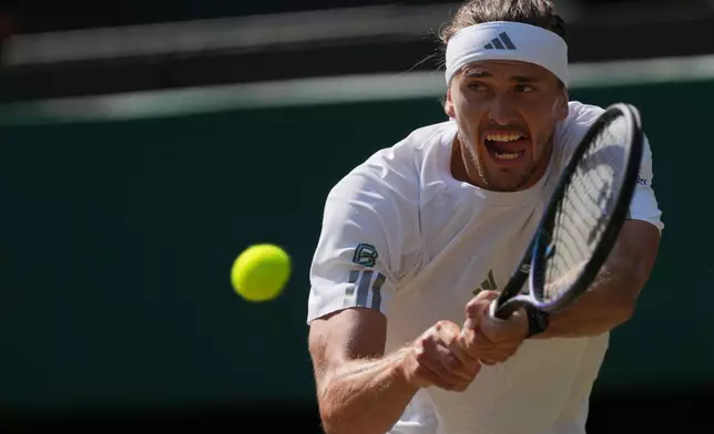 Alexander Zverev of Germany returns the ball to Taylor Fritz of the United States in their quarter-final men's singles match at the Wimbledon Tennis Championships in London, Wednesday, July 8, 2026. (AP Photo/Kin Cheung)