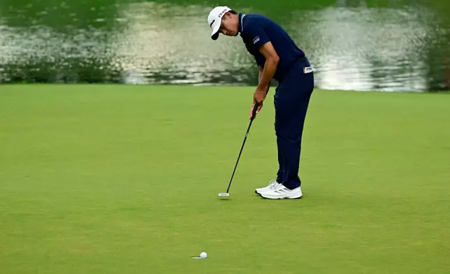 Collin Morikawa's putt for birdie rolls around the lip of the hole and out at 17 during the final round of the Travelers Championship golf tournament at TPC River Highlands, Sunday, June 28, 2026, in Cromwell, Conn. (AP Photo/Jessica Hill)