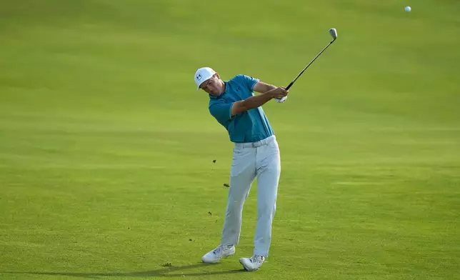 Jordan Spieth hits from the fairway on the 14th hole during the first round of the U.S. Open golf tournament at Shinnecock Hills Golf Club in Southampton, N.Y., Thursday, June 18, 2026.(AP Photo/Gerald Herbert)
