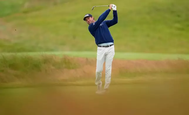 Harris English hits from the fairway on the first hole during the first round of the U.S. Open golf tournament at Shinnecock Hills Golf Club in Southampton, N.Y., Thursday, June 18, 2026.(AP Photo/David J. Phillip)