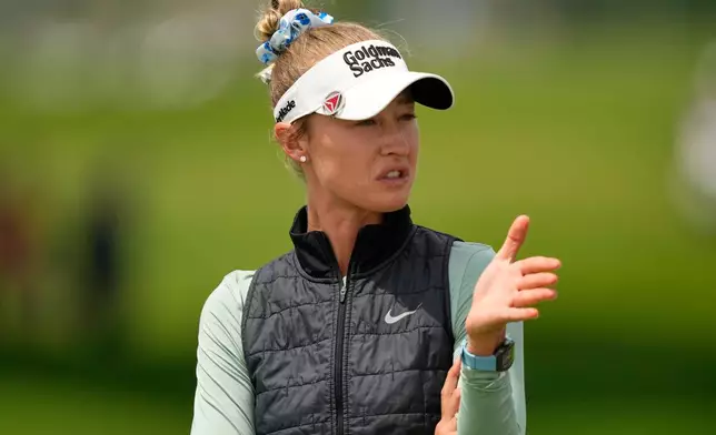Nelly Korda talks to her caddie on the first hole during the final round of the Women's PGA Championship golf tournament at Hazeltine National Golf Club, Sunday, June 28, 2026, in Chaska, Minn. (AP Photo/Matt York)