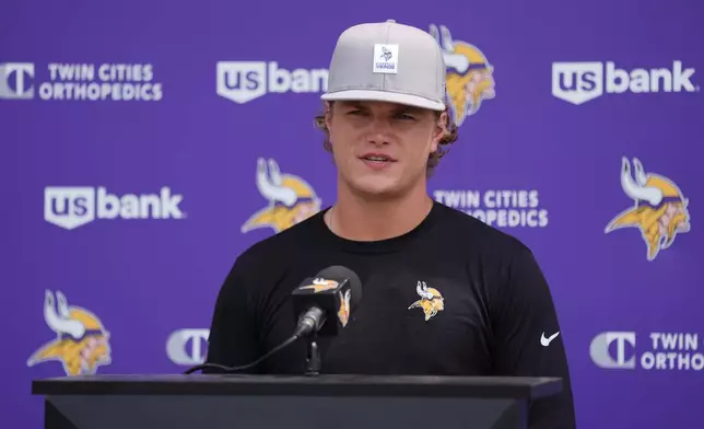 Minnesota Vikings quarterback J.J. McCarthy talks to reporters at the team's NFL football training camp Wednesday, July 29, 2026, in Eagan, Minn. (AP Photo/Abbie Parr)