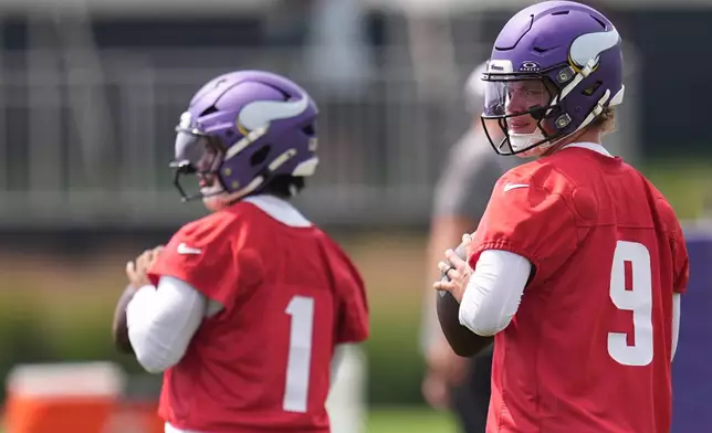 Minnesota Vikings quarterbacks J.J. McCarthy (9) and Kyler Murray (1) take part in drills during the team's NFL football training camp Wednesday, July 29, 2026, in Eagan, Minn. (AP Photo/Abbie Parr)