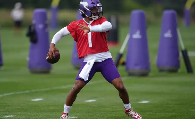 Minnesota Vikings quarterback Kyler Murray (1) takes part in drills during the team's NFL football training camp Wednesday, July 29, 2026, in Eagan, Minn. (AP Photo/Abbie Parr)