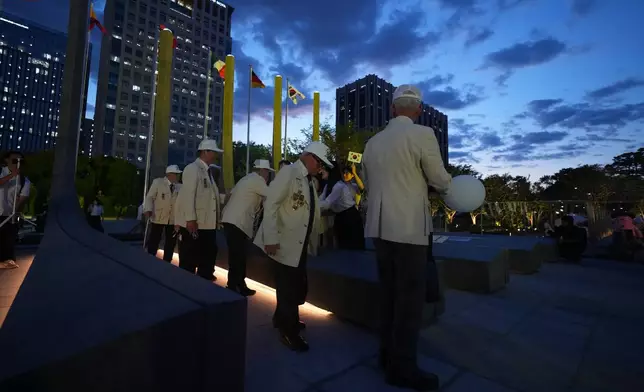 Korean War veterans are greeted after a ceremony to mark the 76th anniversary of the outbreak of the Korean War in Seoul, South Korea, Tuesday, June 23, 2026. (AP Photo/Lee Jin-man)